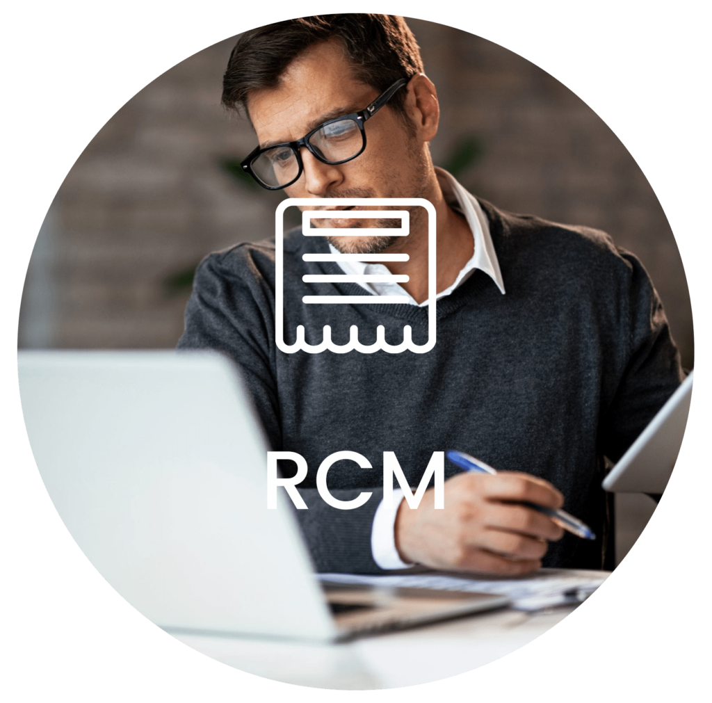 photo of young man working at laptop while holding a tablet with the word RCM centered over the image