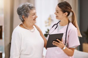 female behavioral health specialist explaining to older woman what does patient-centric treatment mean