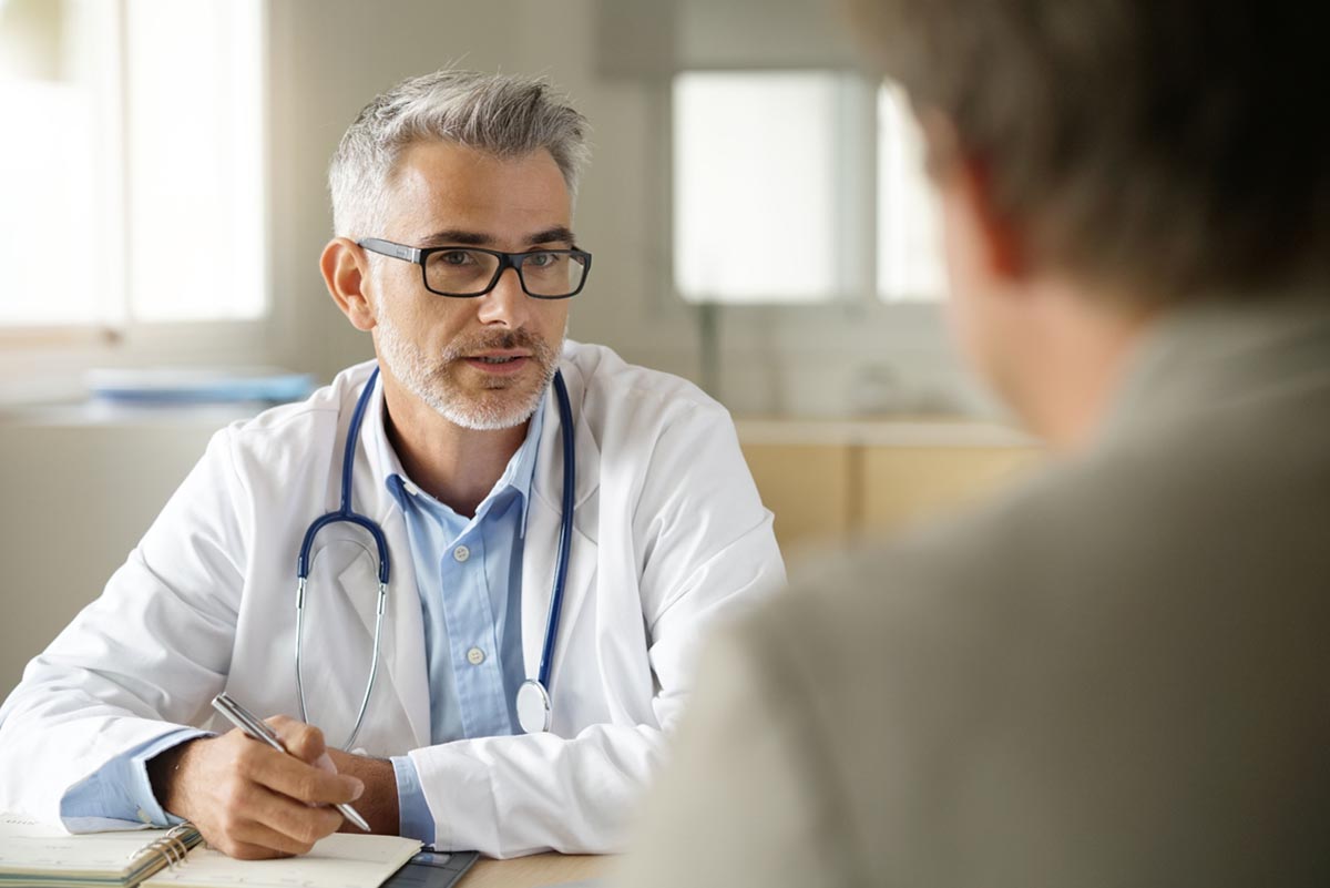 a doctor discusses barriers to substance abuse treatment with a patient