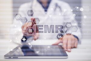 a doctor clicks holographic icons including one that say "EMR" to find out how much does an emr cost