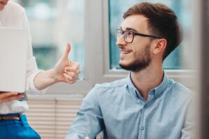 a person listens to another talk about monitoring behavioral health treatment compliance