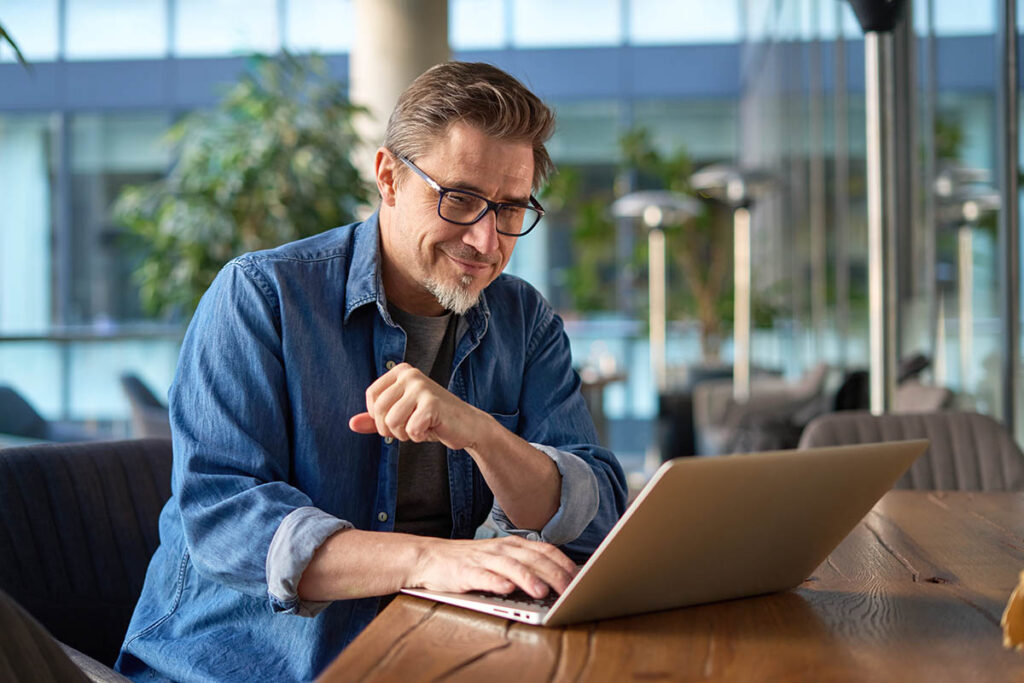 a person researches common issues in behavioral health billing on a computer