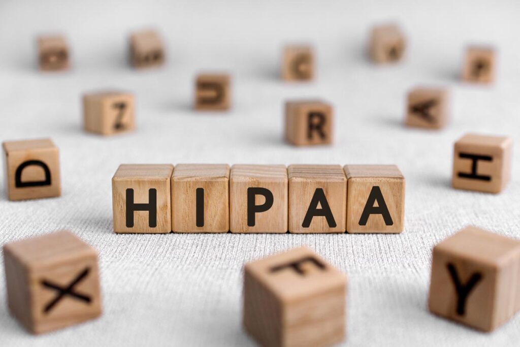 scrabble tiles spell out "hipaa"