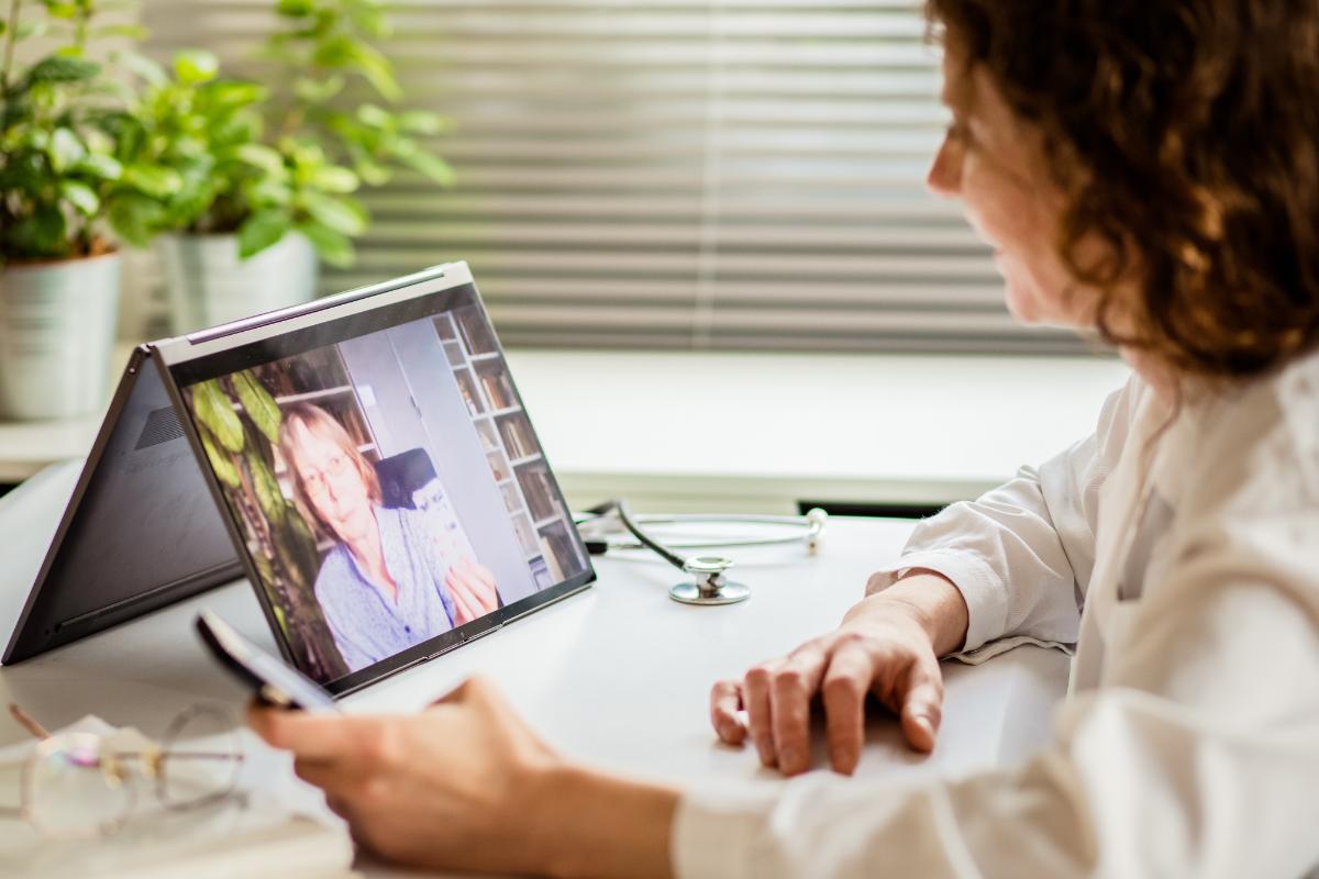a person engages with a provider on a tablet as the explore the benefits of telehealth