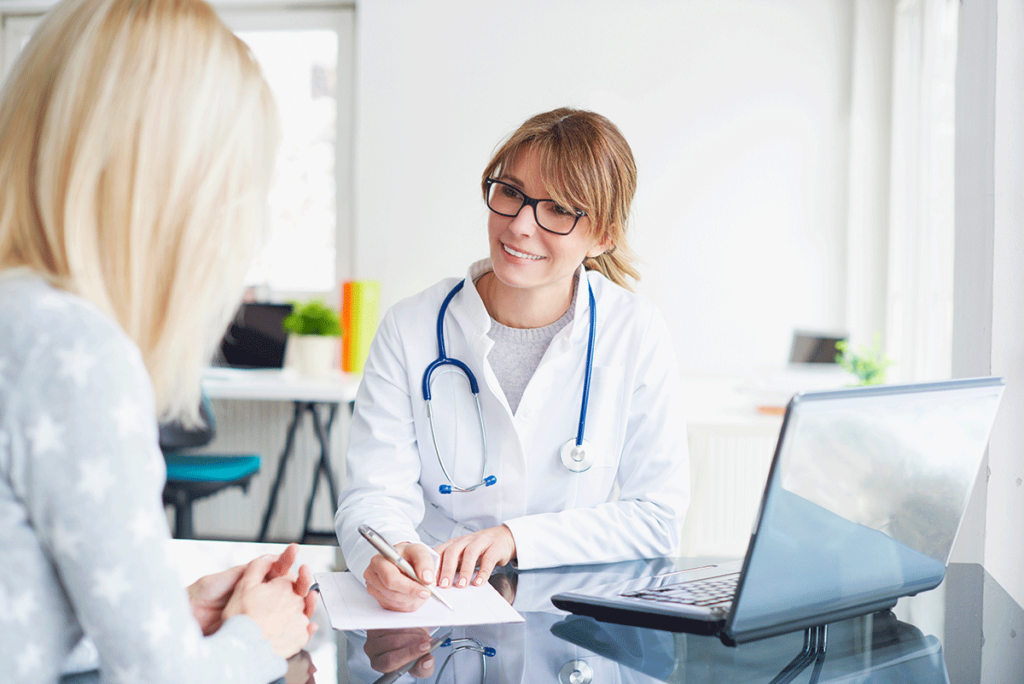 a doctor reviews the benefits of electronic medical records with someone