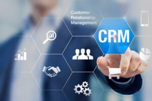 a person clicks on a digital CRM icon to learn about the benefits of customer relationship management