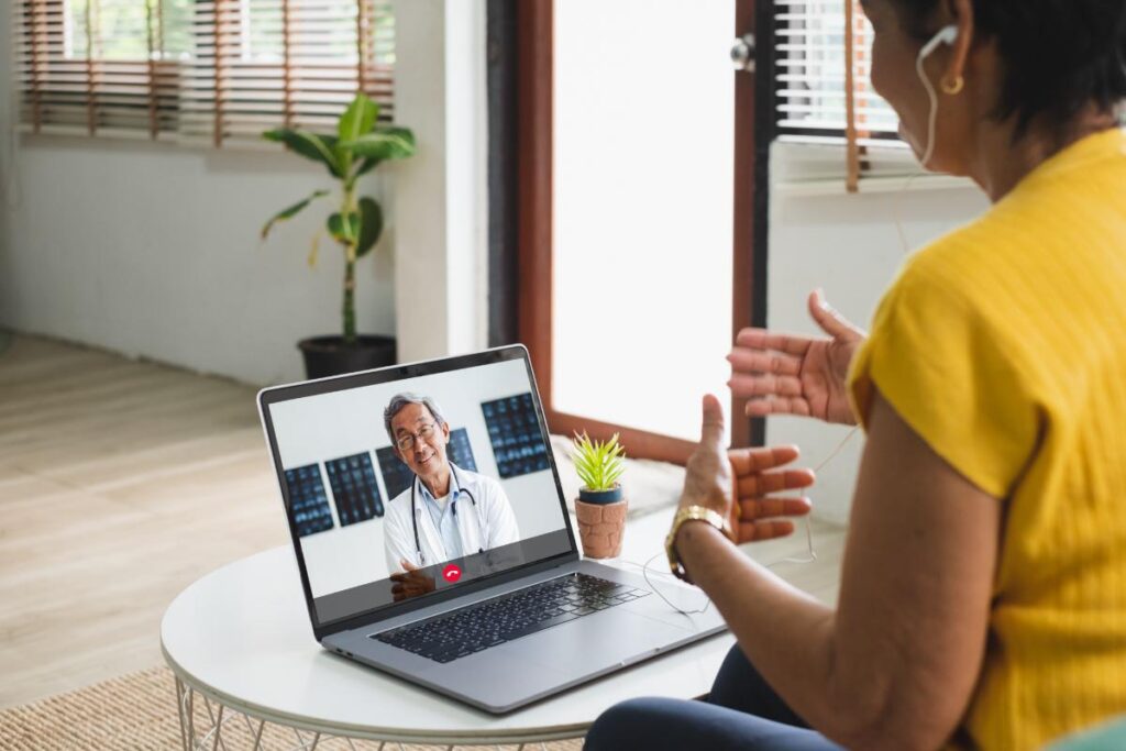 a patient and doctor talk over the internet about advantages of telehealth for behavioral health centers