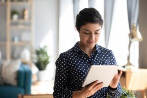 an individual reads a pamphlet about the benefits of electronic medical records for mat clinics