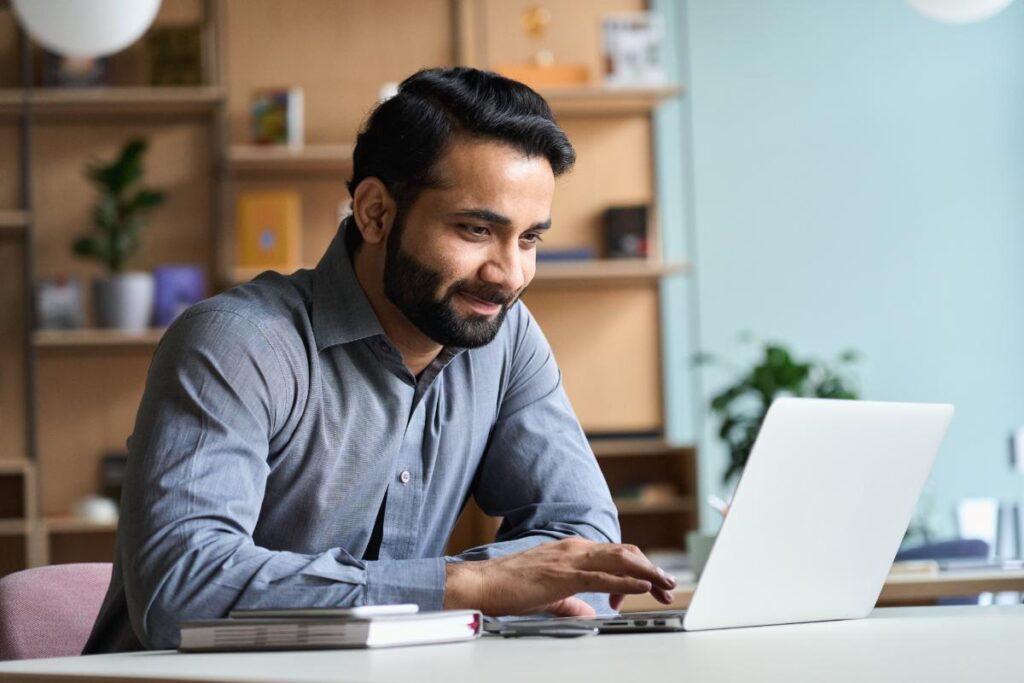 a person uses a computer to research "what are the features of emr software?"